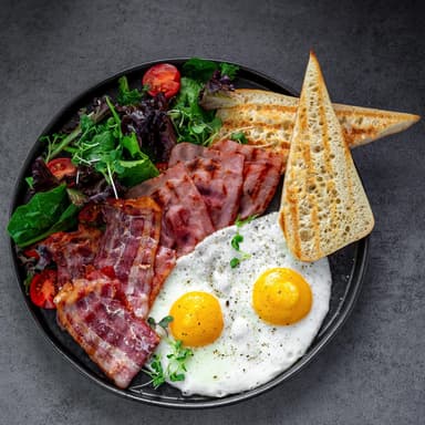Fried eggs with bacon and ham